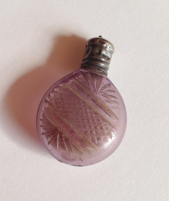 Amethyst glass tiny bottle